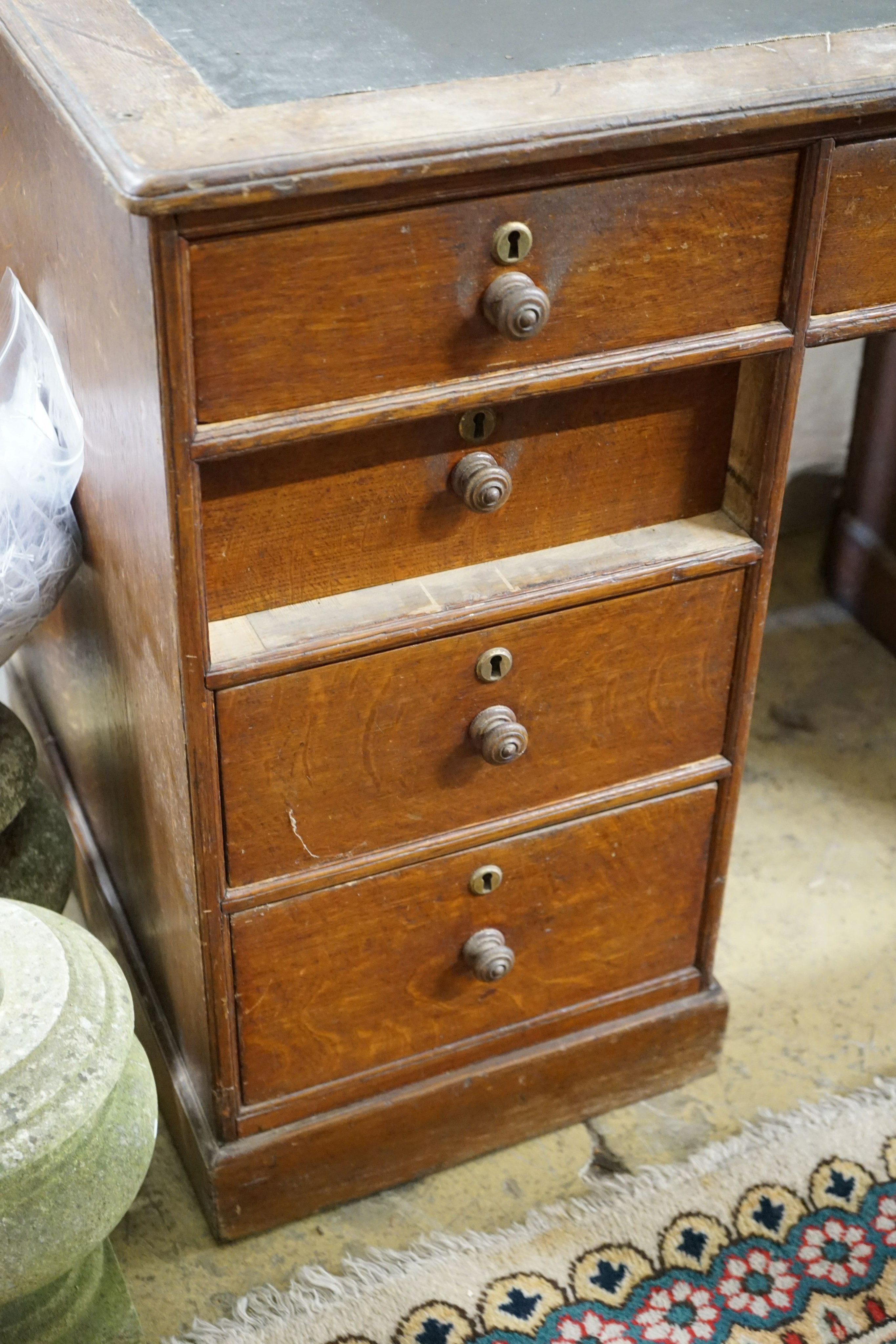 A mid 19th century oak kneehole desk, length 124cm, depth 63cm, height 78cm